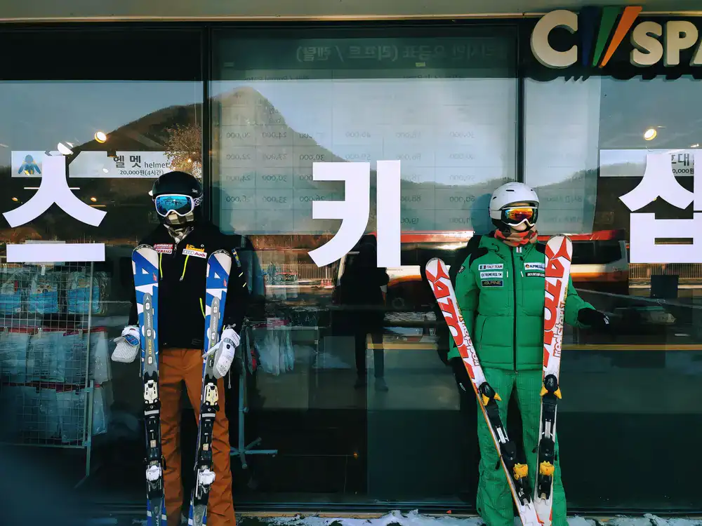 Exterior view of Powderline Rentals shop showing skis