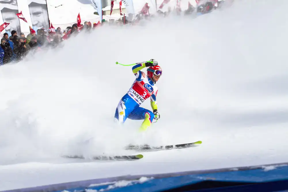 Technician filing the side edge of a ski